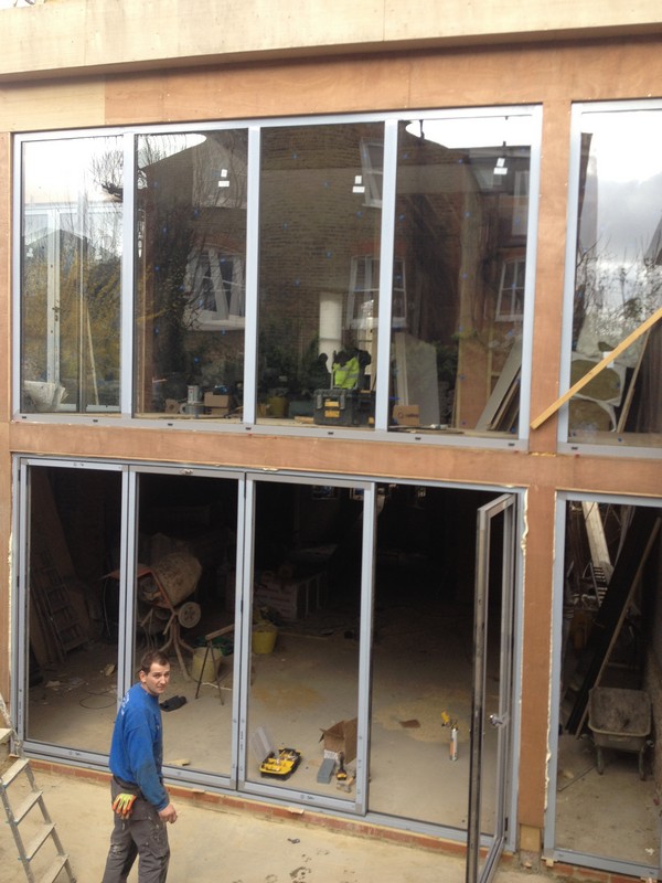 Aluminium bi-fold doors with two-storey glazing in Bayswater