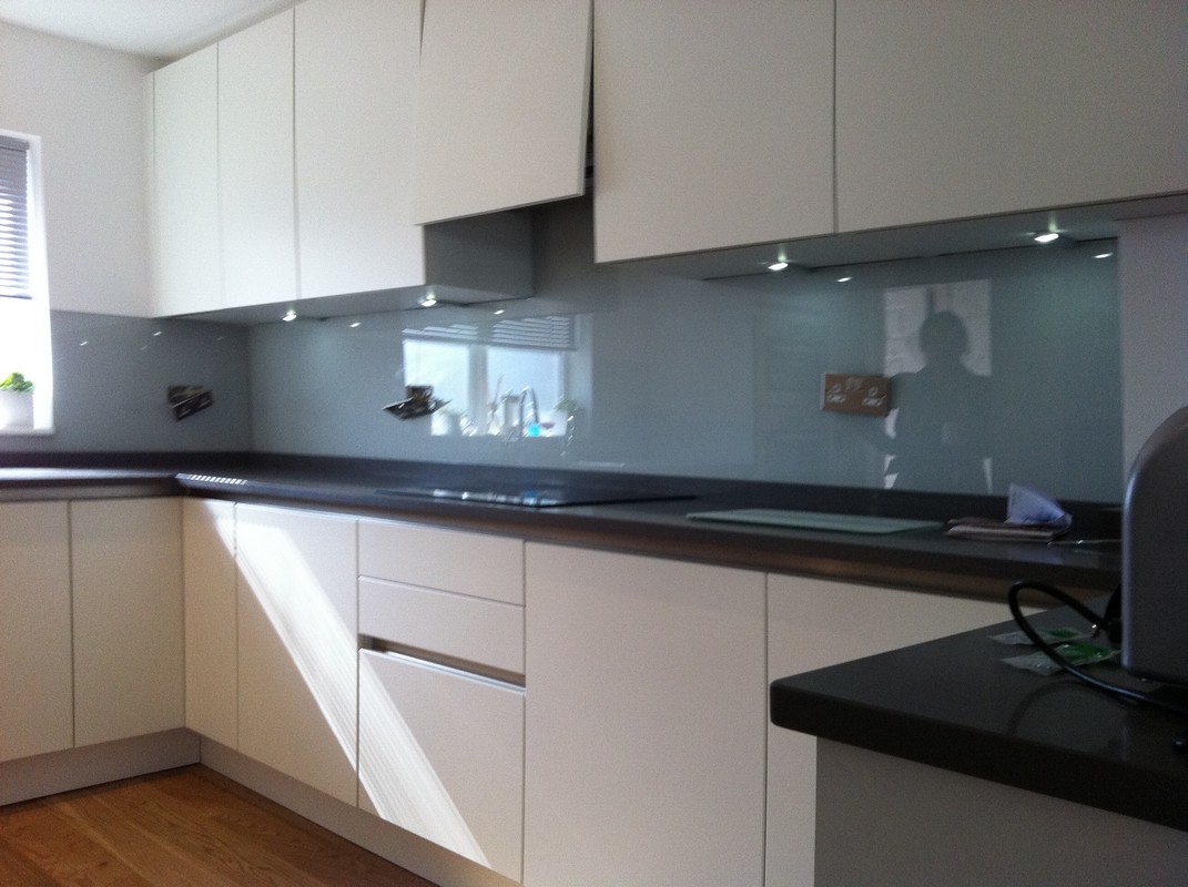 Grey glass kitchen splashback with LED lighting in Bayswater