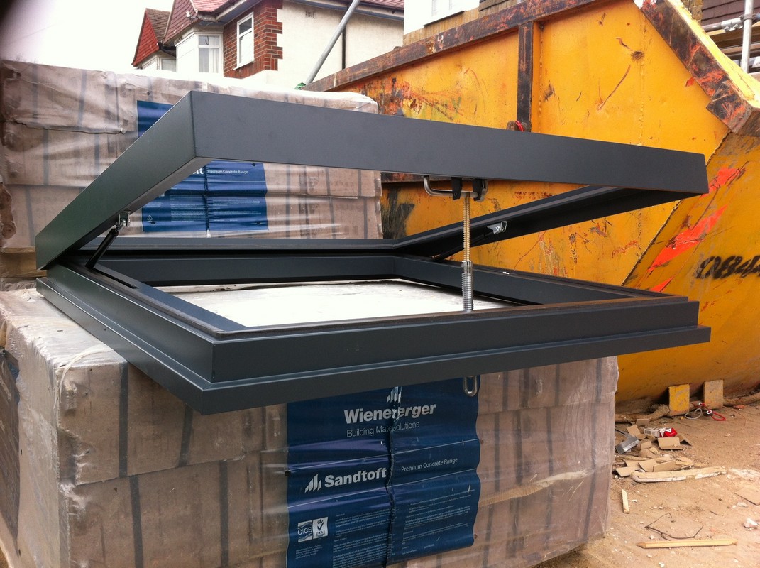 Opening flat roof skylight in anthracite grey installed in Bayswater